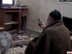 Osama Bin Ladin watches himself on TV