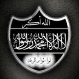 Liwa Thuwar al-Raqqa’s first emblem. On top: “Allahu Akbar.” Beneath that: “There is no deity but God, and Muhammad is the Messenger of God.”