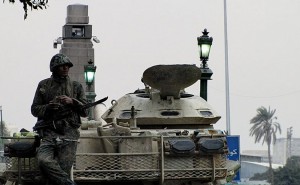 An Egyptian soldier and tank in Tahrir Square, during the 2011 Egyptian Revolution.