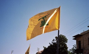 Hezbollah flag waving in Syria. Photo by Upyernoz, Wikipedia Commons.
