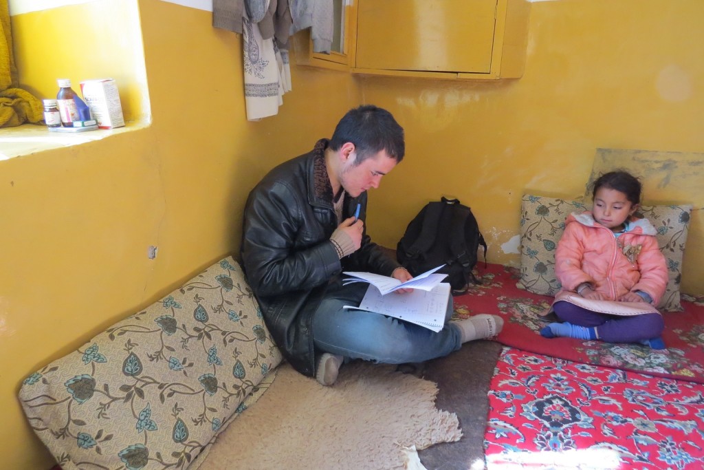 Zek conducting the survey in Zuhair’s home. Zuhair’s sister is looking on. Photo by Dr. Hakim.