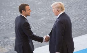 French President Emmanuel Macron welcomes President Donald J. Trump to the reviewing stand for the Bastille Day military parade in Paris, July 14, 2017. Macron and Trump recognized the continuing strength of the U.S.-France alliance from World War I to today. DoD photo by Navy Petty Officer 2nd Class Dominique Pineiro
