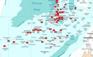 Spratly islands map showing occupied features marked with the flags of countries occupying them. Source: Wikipedia Commons