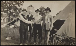Civil War Union and Confederate veterans shake hands at encampment, ca. 1910-1920. (Source: Liljenquist Family collection, Library of Congress Prints and Photographs Division)