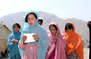An Afghan school girl sings a prayer in celebration and for blessing. Photo Credit: US Army, Wikipedia Commons.