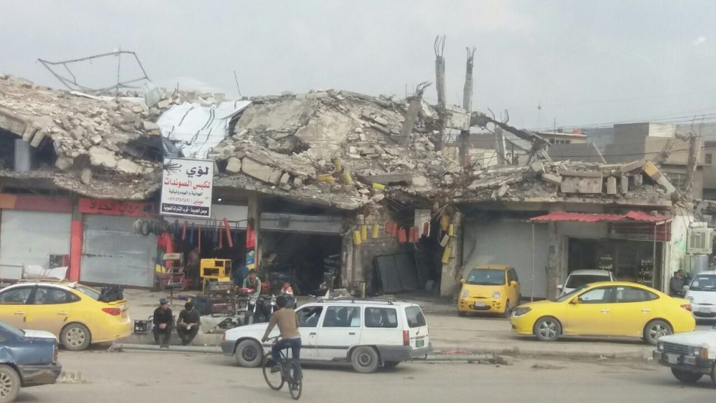 Shop remains open in area of Mosul decimated by bombing, March, 2018. Photo: Abu Mohammed.