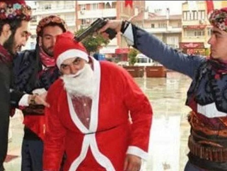 The ultra-nationalist Islamist group Alperen Hearths staged a forced conversion of Santa Claus to Islam, putting a gun to the head of an actor dressed as Santa Claus. This photograph was then posted on Twitter.