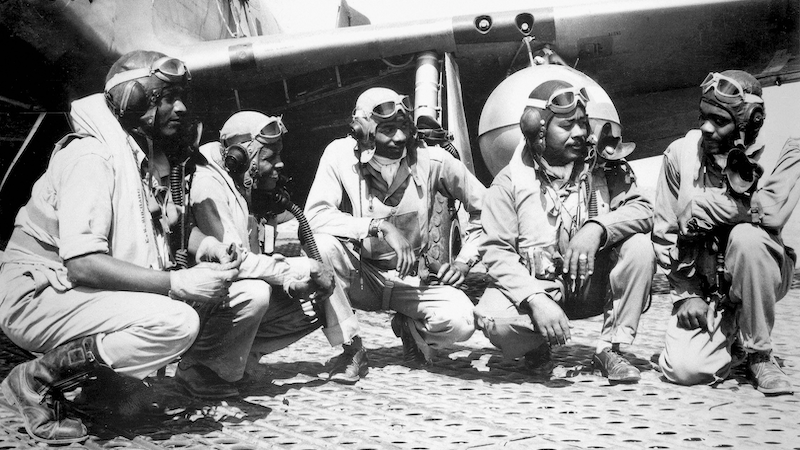Pilots of elite, all-Black 332nd Fighter Group, “Tuskegee Airmen,” at Ramitelli, Italy; left to right, Lieutenant Dempsey W. Morgan, Lieutenant Carroll S. Woods, Lieutenant Robert H. Nelson, Jr., Captain Andrew D. Turner, and Lieutenant Clarence P. Lester, August 1944 (U.S. Air Force)