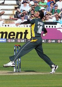Afridi bowling his stock leg-spin delivery