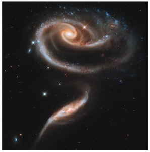 This image of a pair of interacting galaxies called Arp 273 was released to celebrate the 21st anniversary of the launch of the NASA/ESA Hubble Space Telescope. The distorted shape of the larger of the two galaxies shows signs of tidal interactions with the smaller of the two. It is thought that the smaller galaxy has actually passed through the larger one. Credit: NASA, ESA and the Hubble Heritage Team (STScI/AURA)