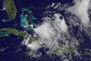 Caption: This visible image of Emily's remnant clouds was taken from the GOES-13 satellite on Aug. 5 at 16:01 UTC (12:01 p.m. EDT) just north of the eastern tip of Cuba. Higher thunderstorms in the center are casting small shadows on the lower, less powerful thunderstorms around them.  Credit: NASA/NOAA GOES Project, Dennis Chesters
