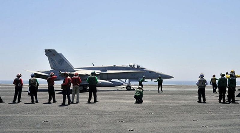 An American F/A-18C Hornet aboard USS George H.W. Bush prior to the launch of operations over Iraq. U.S. Navy photo by Mass Communication Specialist 3rd Class Margaret Keith