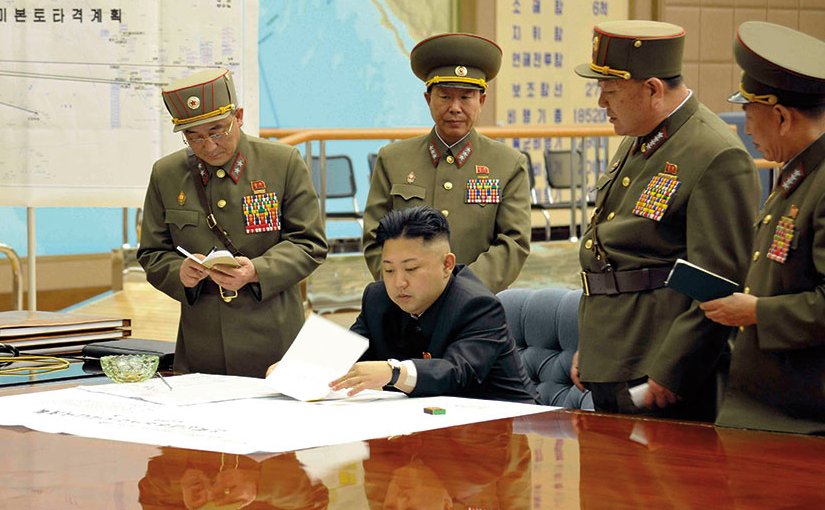 KimKim Jong-un sitting at desk in what appears a dedicated military operations room (Korean Central News Agency via NDU Press)