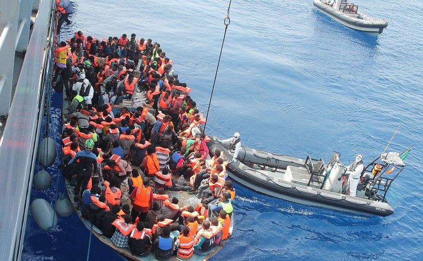 Irish Naval personnel from the LÉ Eithne (P31) rescuing migrants as part of Operation Triton. Photo Credit: Irish Defence Forces, Wikipedia Commons.