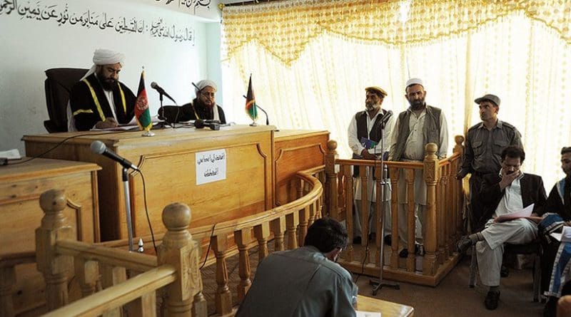 Khas Kunar chief of police was charged with misuse of his position (1 year in prison) and logistics officer was charged with corruption (61 months and fine) during rare public trial at Kunar provincial courthouse (U.S. Air Force/Christopher Marasky)