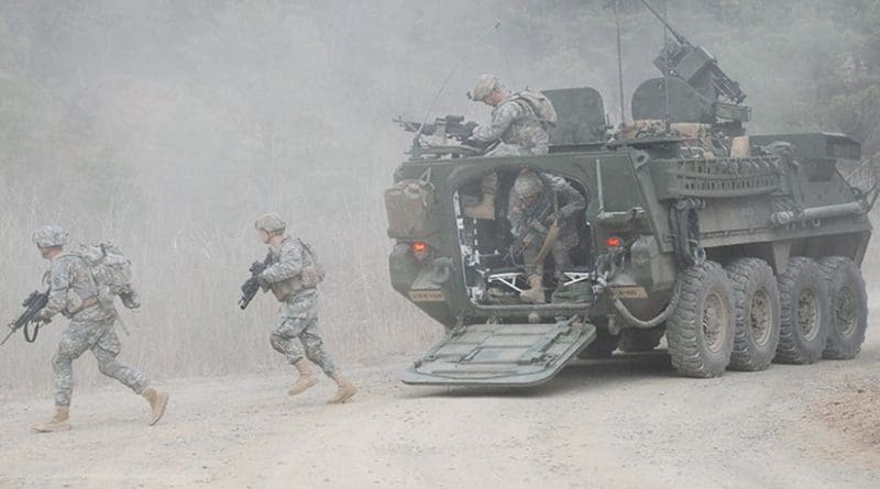 Soldiers dismount from Stryker vehicle during Foal Eagle 2012 as part of Combined Arms Live Fire Exercise at Rodriguez Range Complex, South Korea (U.S. Army)