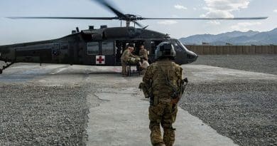 Servicemember trained as tactical critical care evacuation team nurse prepares for patient transfer mission at Forward Operating Base Orgun East, Afghanistan (U.S. Air Force/Marleah Miller)