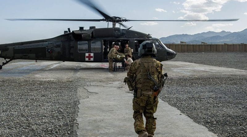 Servicemember trained as tactical critical care evacuation team nurse prepares for patient transfer mission at Forward Operating Base Orgun East, Afghanistan (U.S. Air Force/Marleah Miller)