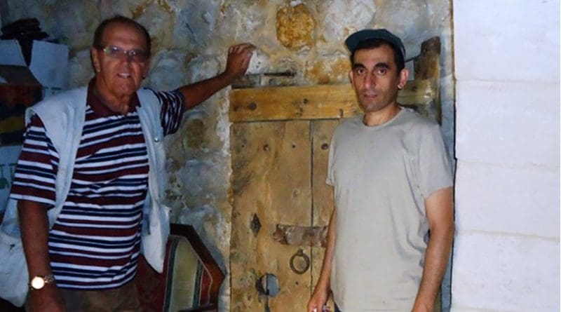 An American visitor and his guide Jesus (Issa) with the 1,700 year old door of St. Trecla, which was stolen on 9/13/2013 was returned in February 2015 when it was discovered in Lebanon’s Bekaa valley.