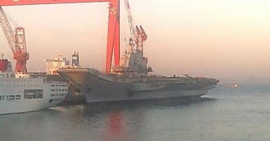China's aircraft carrier the Liaoning (formerly the Russian ship Riga and subsequently renamed the Varyag before being sold to China) being refit in 2011. Photo Credit: Yhz1221, Wikipedia Commons.