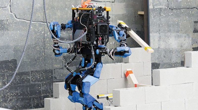 Team SCHAFT’s robot, S-One, clears debris at DARPA’s Robotics Challenge trials (DARPA/Raymond Sheh)