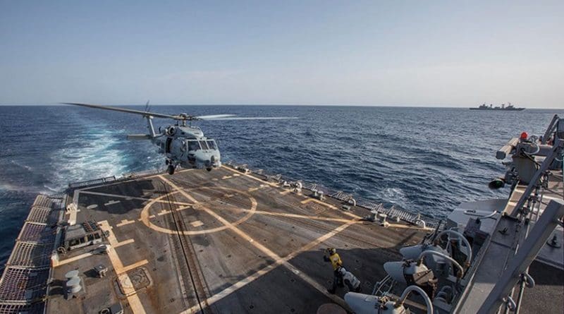MH-60S Seahawk helicopter assigned to “Swamp Foxes” of Maritime Helicopter Combat Squadron 74 departs USS Mason during U.S.-China cross-deck landing exercise with People’s Liberation Army Navy destroyer Harbin (U.S. Navy/Rob Aylward)