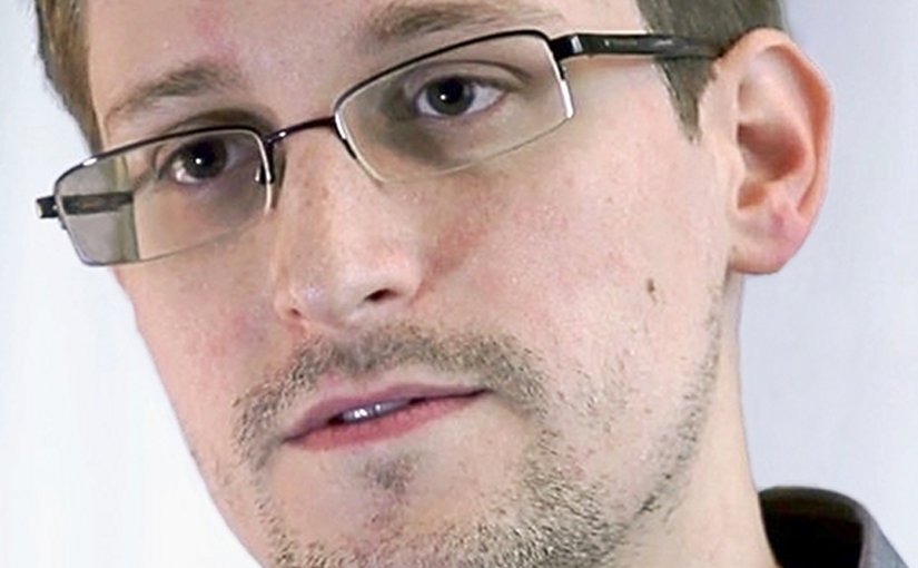 Edward Snowden. Photo Credit: Screenshot of the film Prism by Praxis Films, Laura Poitras, Wikipedia Commons.