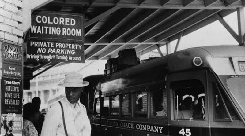 Sign for the "colored" waiting room at a bus station in Durham, North Carolina, 1940. Photo by Jack Delano, Wikipedia Commons.