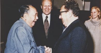 Gerald Ford watches as Henry Kissinger shakes hands with Mao Zedong, December 2, 1975. Photo: Courtesy Gerald R. Ford Library, Wikipedia Commons.