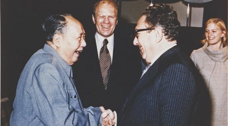 Gerald Ford watches as Henry Kissinger shakes hands with Mao Zedong, December 2, 1975. Photo: Courtesy Gerald R. Ford Library, Wikipedia Commons.