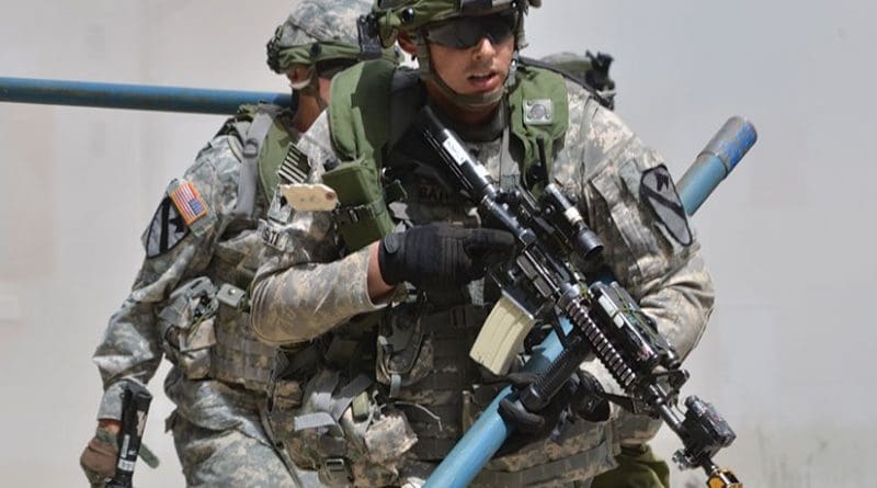 Soldiers of 91st Brigade Engineer Battalion, 1st Brigade Combat Team, 1st Cavalry Division, prepare to breach road block set up by opposition forces during exercise Combined Resolve II at Joint Multinational Readiness Center in Hohenfels, Germany, May 2014 (U.S. Army/Nicholaus Williams)