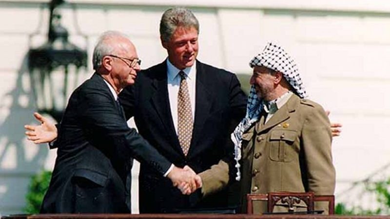 Yitzhak Rabin, Bill Clinton, and Yasser Arafat at the Oslo Accords signing ceremony on September 13, 1993. Photo Credit: Vince Musi, The White House.