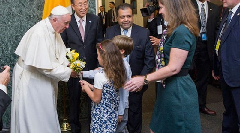 Pope Francis is welcomed by Secretary-General Ban Ki-moon and receives flower bouquets from children of UN staff members at the start of his visit to UN Headquarters. UN Photo/Mark Garten