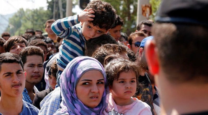 Refugees wait to cross the Greek-Macedonia border, 24 August 2015. Photo Credit: Bundesministerium für Europa, Integration und Äusseres, Wikipedia Commons.