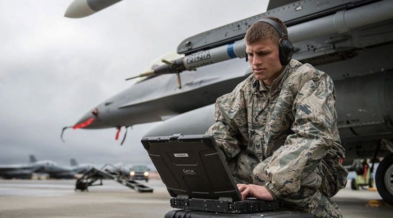 Crew chief with 36th Aircraft Maintenance Unit, Osan Air Base, South Korea, checks computer data during Red Flag-Alaska 14-2, ensuring F-16 Fighting Falcon readiness (U.S. Air Force/Peter Reft)