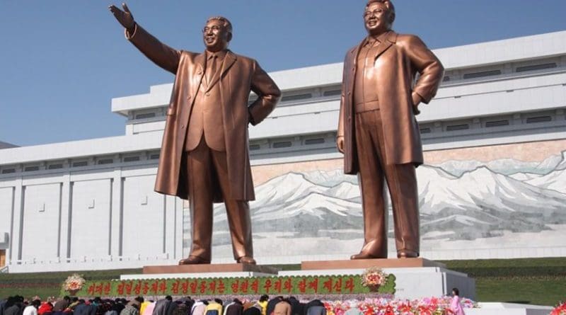 North Koreans bowing to the statues of Kim Il-sung (left) and Kim Jong-il. Photo by J.A. de Roo, Wikipedia Commons.