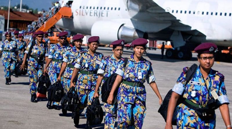 An all-female Formed Police Unit from Bangladesh, serving with the UN Stabilization Mission in Haiti, arrives in Port-au-Prince to assist with post-earthquake reconstruction. UN Photo/Marco Dormino