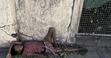 A Rohingya youth sleeps on the street in Burma. Photo Source: Queen Mary, University of London.