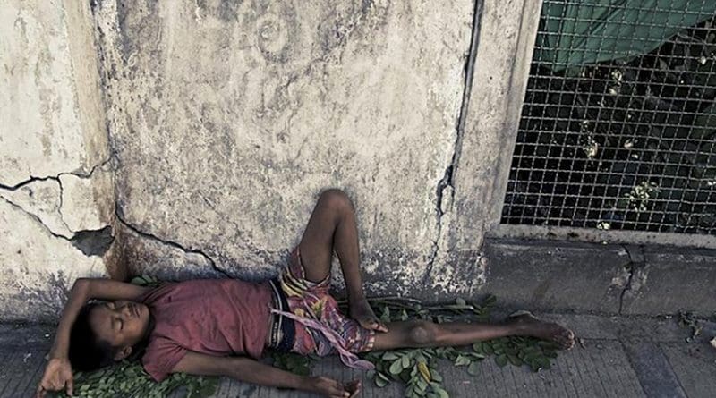 A Rohingya youth sleeps on the street in Burma. Photo Source: Queen Mary, University of London.