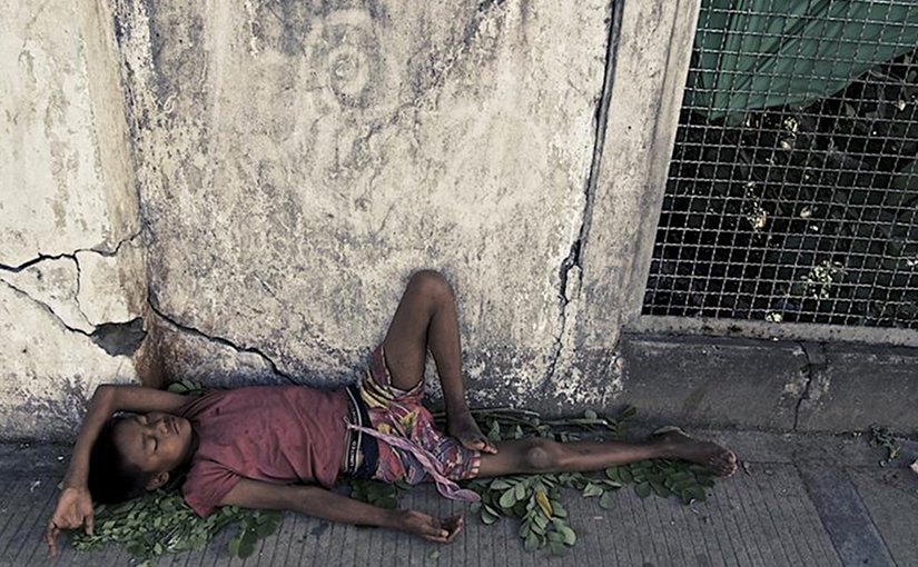 A Rohingya youth sleeps on the street in Burma. Photo Source: Queen Mary, University of London.