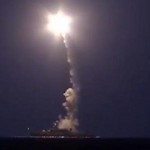 A screenshot from a video released by Russia's defense ministry shows a Russian warship firing cruise missiles into Syria from the Caspian Sea.