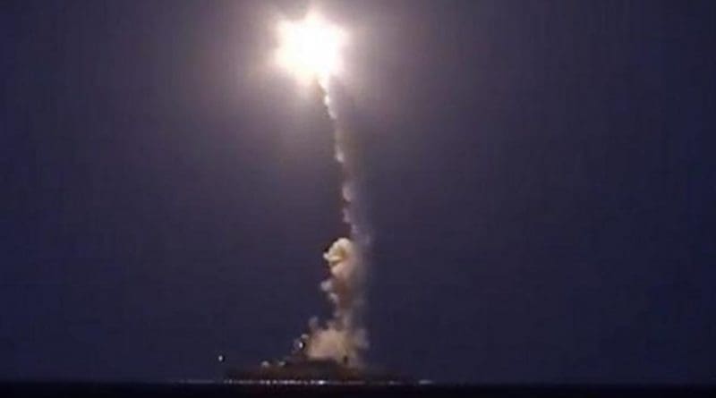 A screenshot from a video released by Russia's defense ministry shows a Russian warship firing cruise missiles into Syria from the Caspian Sea.