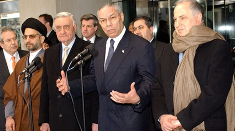 Former U.S. Secretary of State Colin Powell with Members of The Iraqi Governing Council After Their Meeting. Pictured from left to right: Abdul Aziz Al Hakim; Dr. Adnan Pachachi, President of Iraqi Governing Council for January 2004; Ambassador Paul Bremer, U.S. Presidential Envoy to Iraq; Secretary Powell and Dr. Ahmed Chalabi. U.S. State Department photo by Michael Gross.