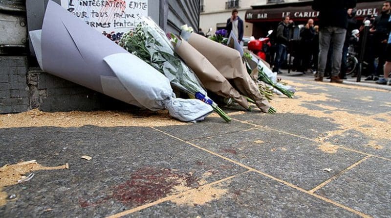 The Le Petit Cambodge restaurant with a makeshift memorial of flowers, the day after the November 2015 attacks in Paris, France. Photo by Maya-Anaïs Yataghène, Wikipedia Commons.