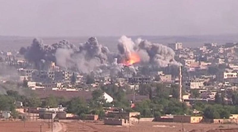 Coalition airstrike on Islamic State position, October 2014. Photo Credit: Voice of America News: Scott Bobb reports from the Suruç, Turkey/ Kobane, Syrian border; "Turkish Border Towns Hosting Thousands of Kobani Refugees", Wikipedia Commons.