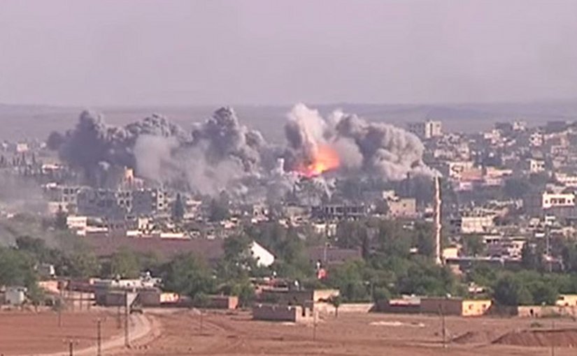 Coalition airstrike on Islamic State position, October 2014. Photo Credit: Voice of America News: Scott Bobb reports from the Suruç, Turkey/ Kobane, Syrian border; "Turkish Border Towns Hosting Thousands of Kobani Refugees", Wikipedia Commons.