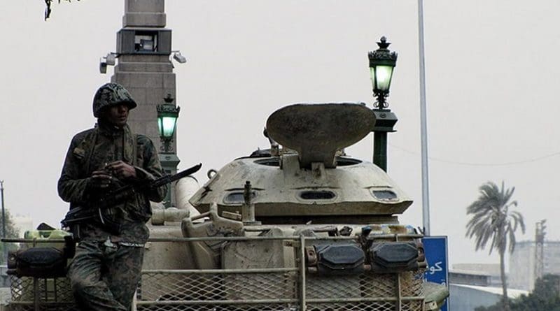 An Egyptian soldier and tank in Tahrir Square, during the 2011 Egyptian Revolution.