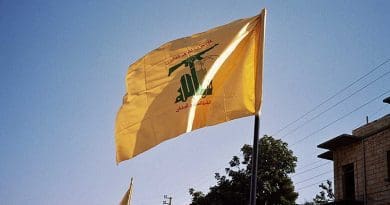 Hezbollah flag waving in Syria. Photo by Upyernoz, Wikipedia Commons.