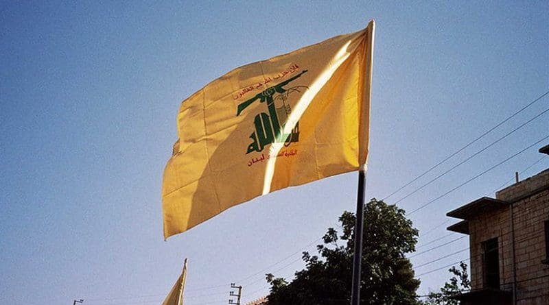 Hezbollah flag waving in Syria. Photo by Upyernoz, Wikipedia Commons.