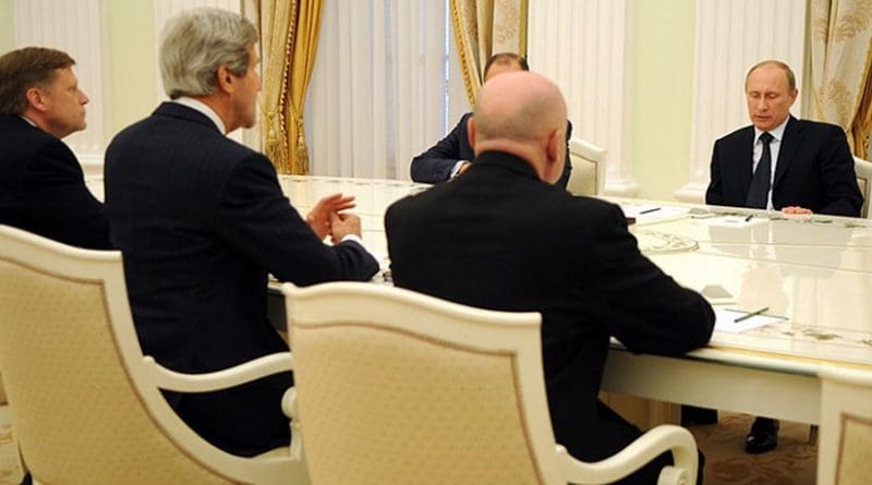 File photo of U.S. Secretary of State John Kerry, accompanied by U.S. Ambassador to Russia Michael McFaul, left, meeting with Russian President Vladimir Putin and Russian Foreign Minister Sergey Lavrov in Moscow. Photo Credit: US State Department, Wikipedia Commons.